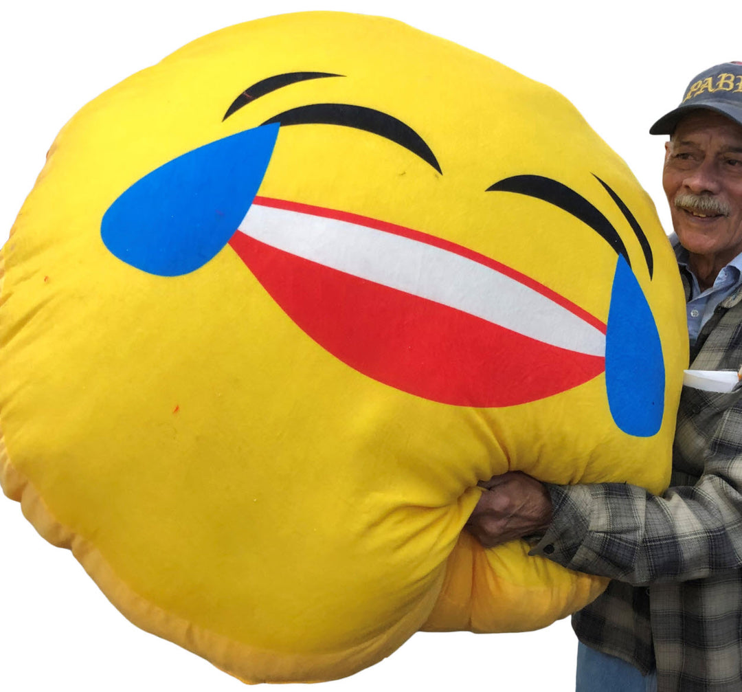Giant Stuffed Emoji Face with Tears of Joy measures over three and a half feet wide.