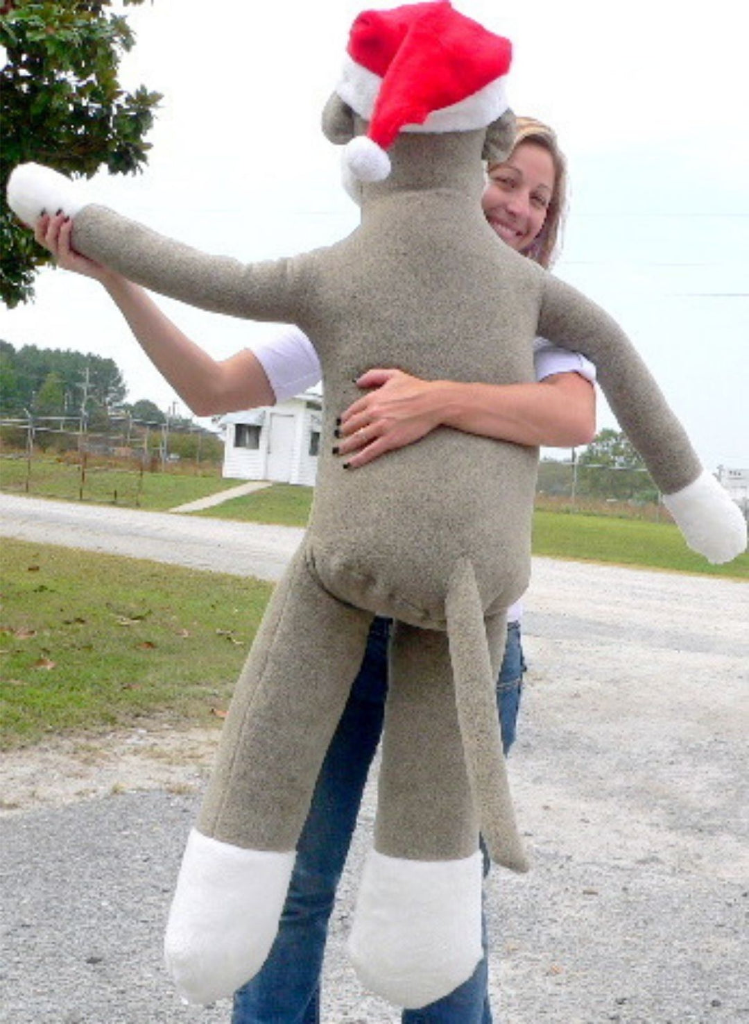 American Made Big Plush Christmas Sock Monkey 54 inches tall Wearing Red Santa Hat